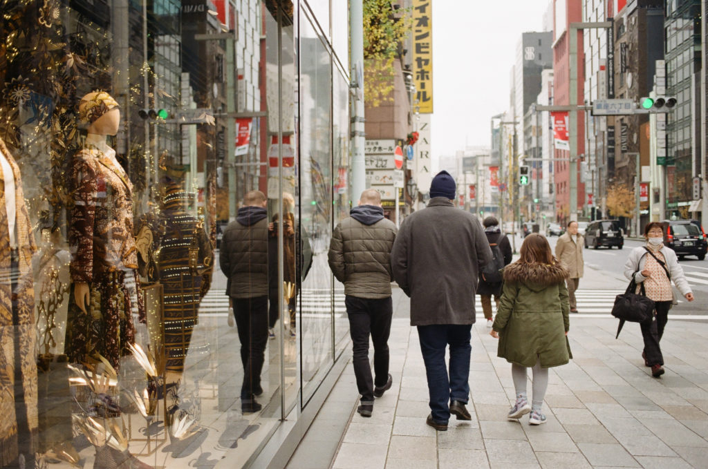 group of people walking in Ginza district Tokyo Japan