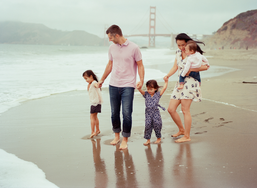 family of 5 in front of the golden gate bridge