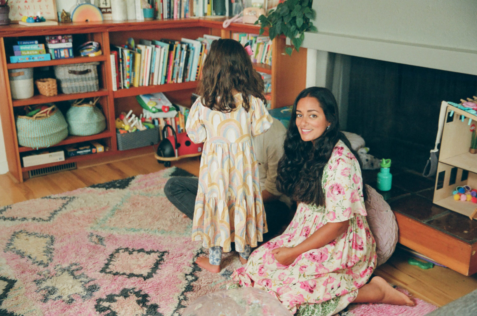photo of Anjelika Temple in her living room with her older daughter
