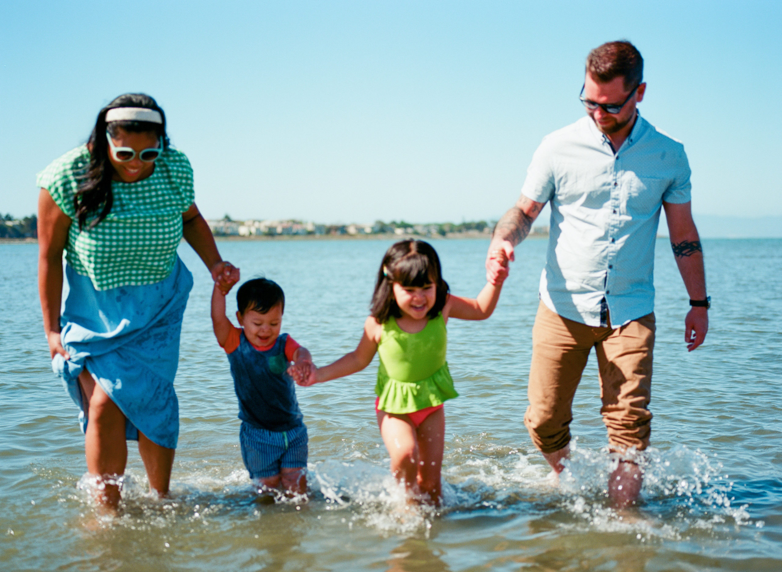 family of four out of focus in ocean